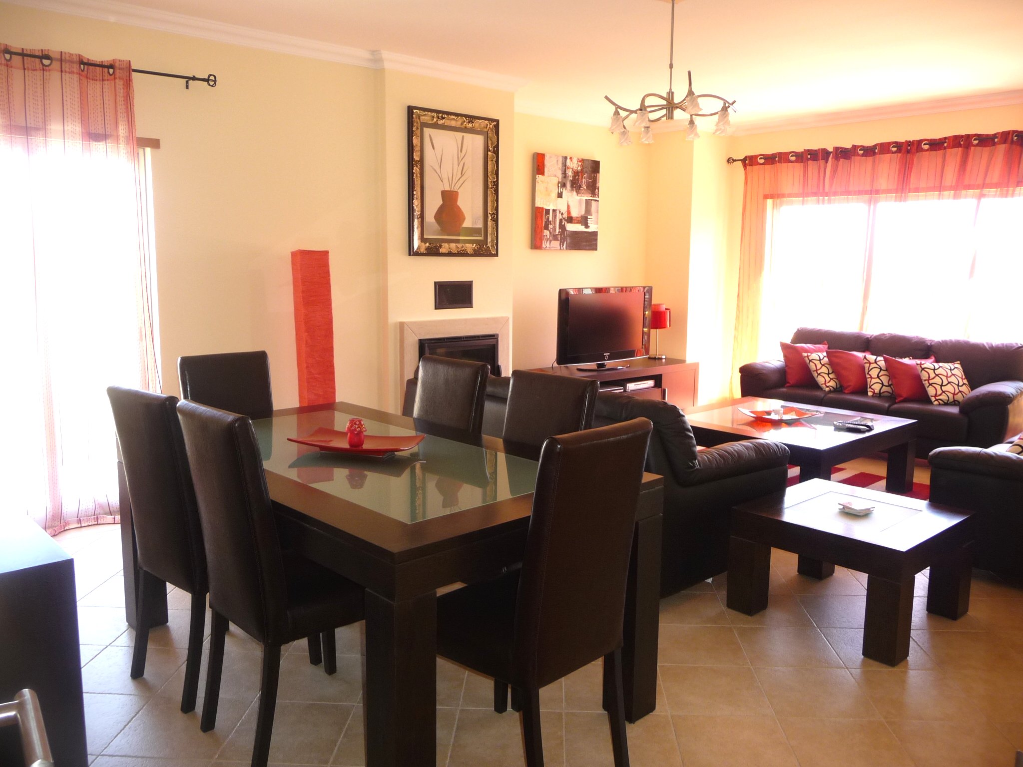 Spacious living room with dining area and wood burner stove
